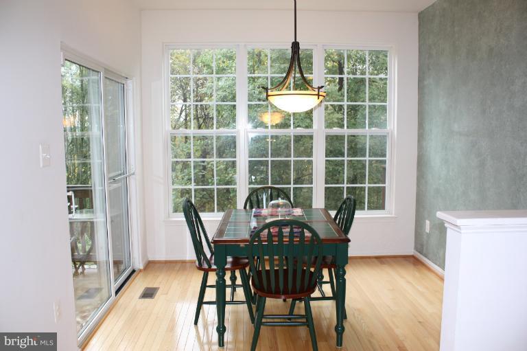 3742 Hope Commons Circle Frederick, MD 21704 - Photo 7 of 17 a view of a dining room with furniture window and outside view