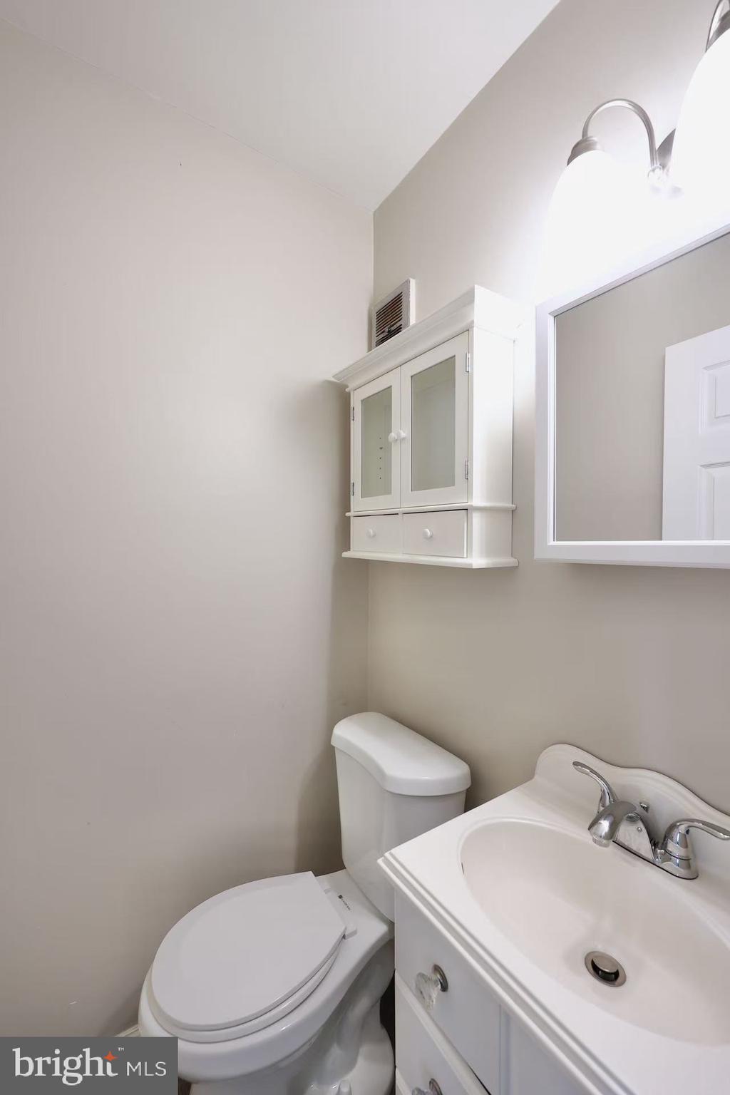 11850 Basile Road Philadelphia, PA 19154 - Photo 14 of 31 a white toilet sitting next to a bathroom sink
