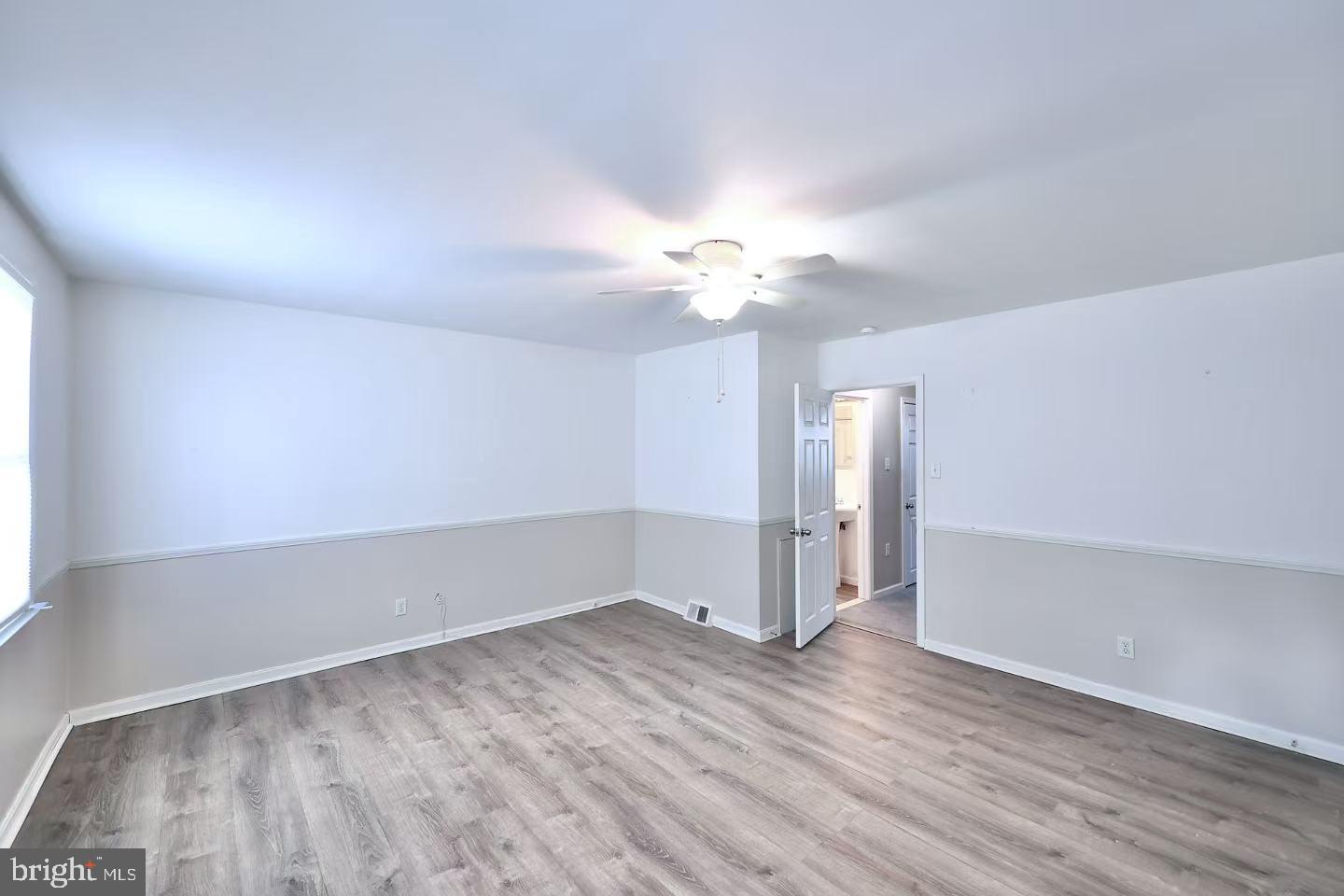 11850 Basile Road Philadelphia, PA 19154 - Photo 17 of 31 an empty room with wooden floor and window
