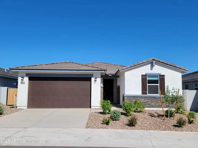 a front view of a house with a garage