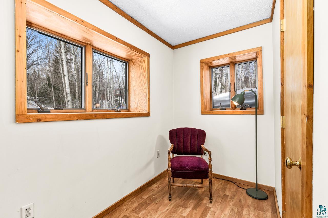 67 Snowshoe Trail Tofte, MN 55615 - Photo 39 of 42 Sitting room featuring ornamental molding and light wood-type flooring