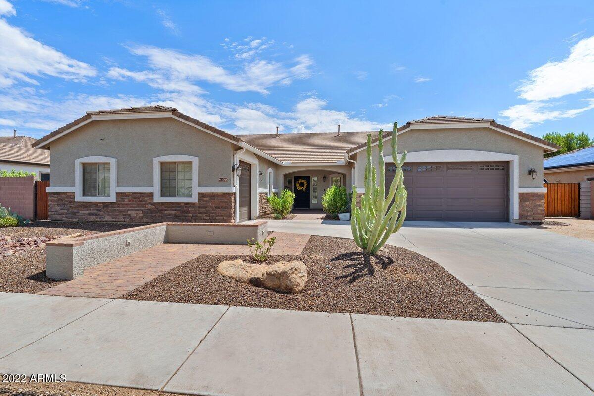 21973 East Rosa Road Queen Creek, AZ 85142 - Photo 1 of 15 a front view of a house with garden