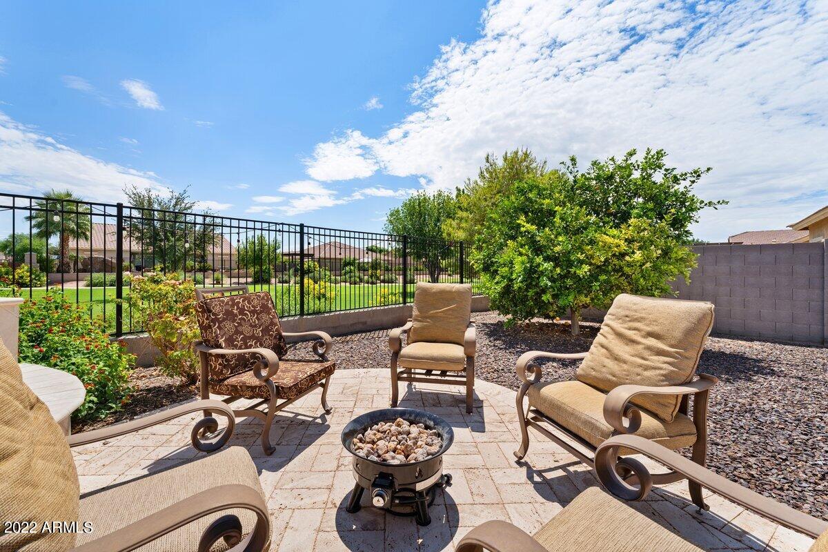 21973 East Rosa Road Queen Creek, AZ 85142 - Photo 15 of 15 a view of a patio with couches table and chairs and potted plants