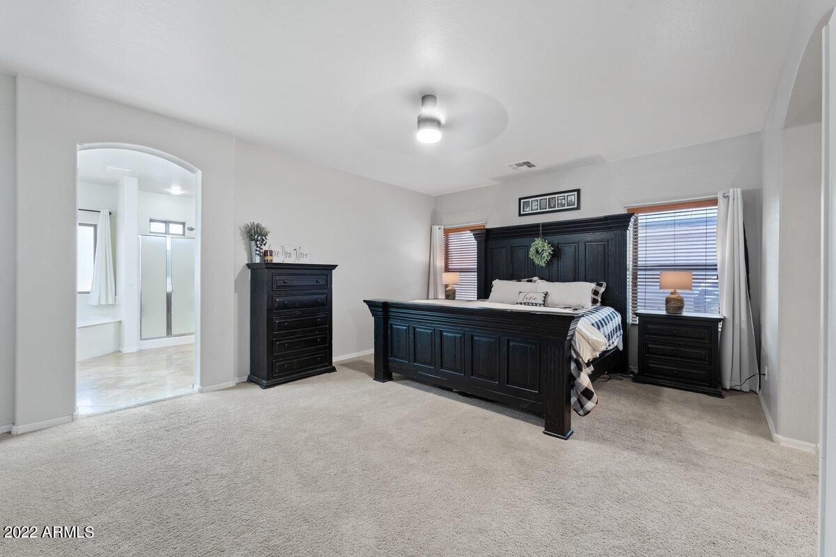 21973 East Rosa Road Queen Creek, AZ 85142 - Photo 7 of 15 a bedroom with furniture and window