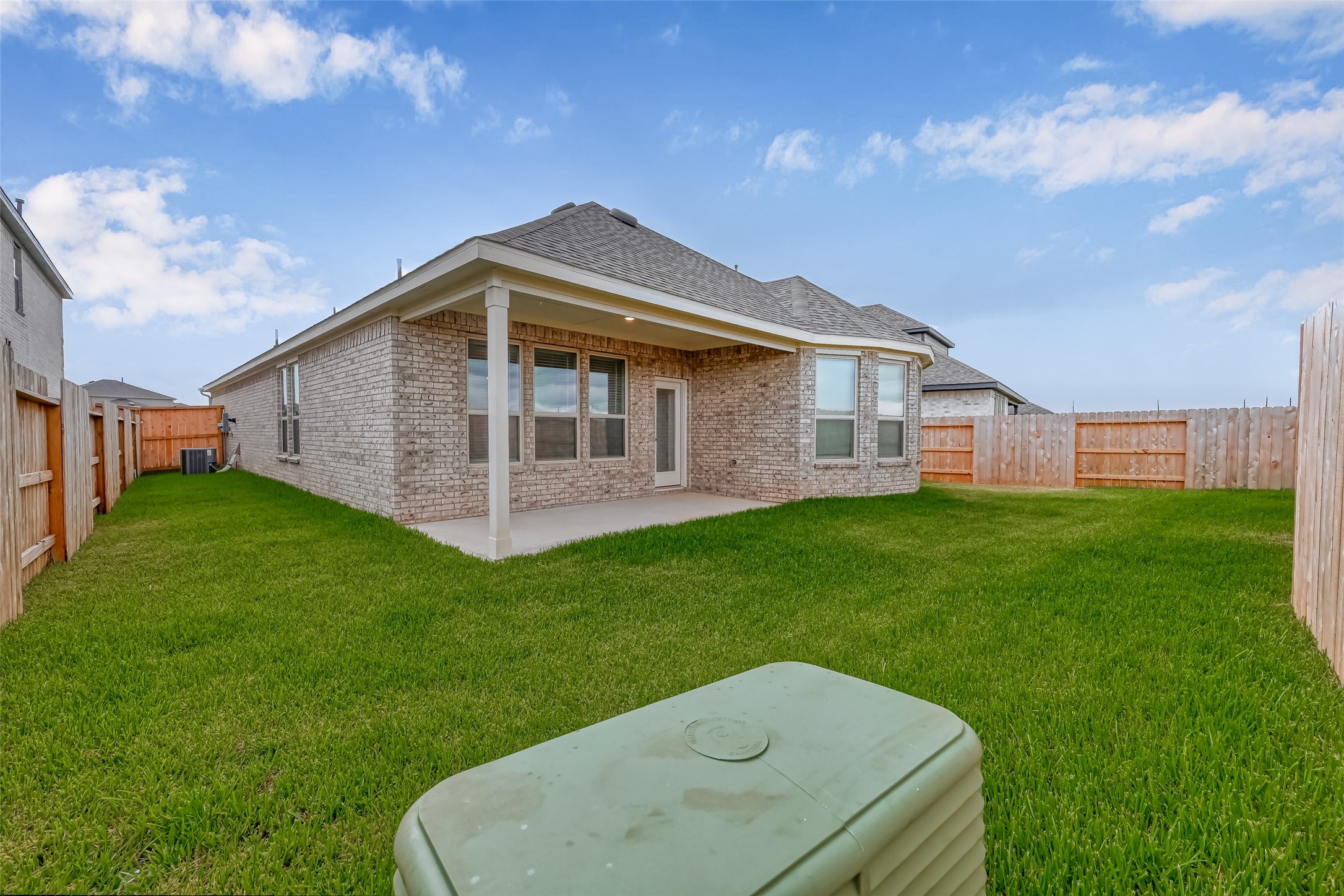 1308 Tan Gable Lane Katy, TX 77493 - Photo 30 of 30 a backyard of a house with a garden and barbeque oven