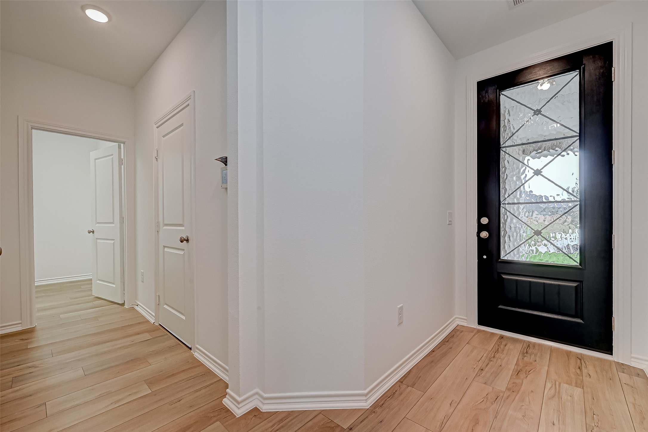 1308 Tan Gable Lane Katy, TX 77493 - Photo 4 of 30 wooden floor in an empty room with a window