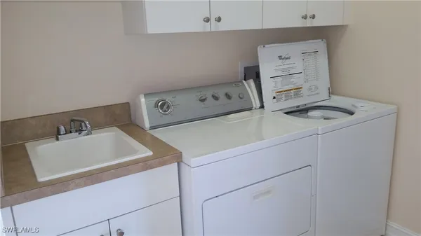 a utility room with dryer and washer