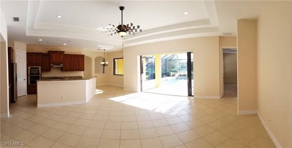 a view of a kitchen with a sink and a refrigerator
