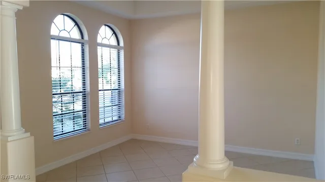 a view of empty room with windows