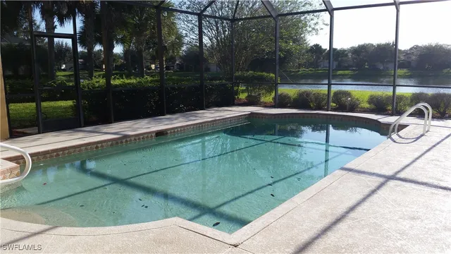 a view of swimming pool with a patio