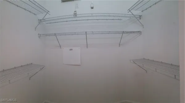 a view of a room with racks on the wall