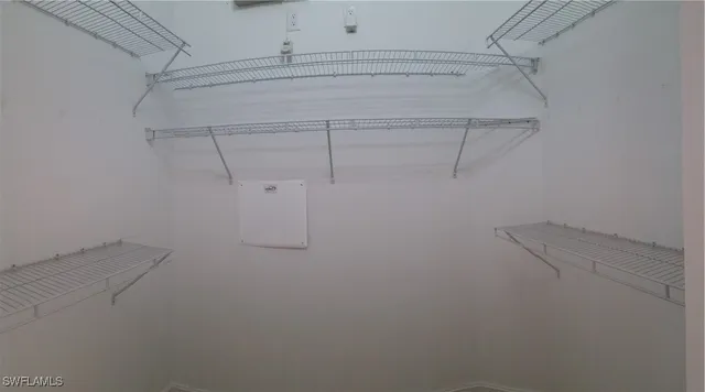 a view of a room with racks on the wall