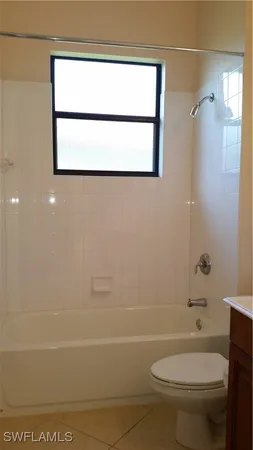 a bathroom with a toilet a sink and a bathtub