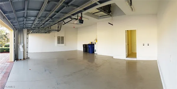 a view of a hallway with wooden walls