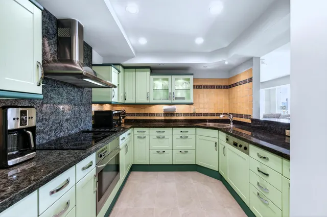 a house with palm tree in front of it