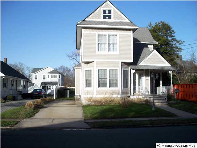 602 Ocean Road Spring Lake Heights, NJ 07762 - Photo 1 of 2 a front view of a house with a yard