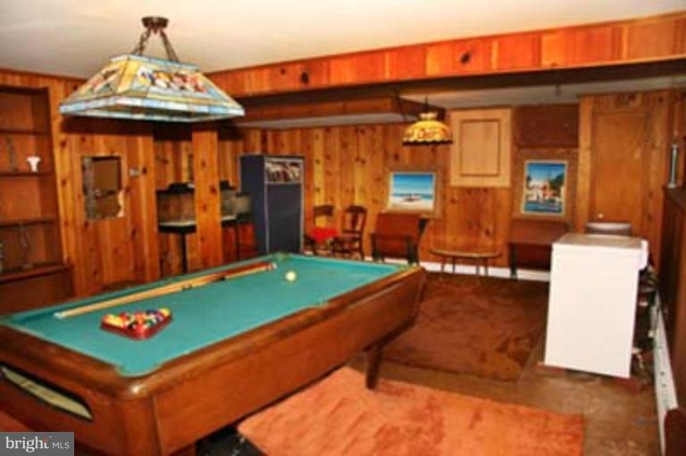 4119 Raleigh Road Pikesville, MD 21208 - Photo 2 of 15 a room with pool table and furniture
