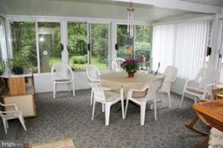 4119 Raleigh Road Pikesville, MD 21208 - Photo 10 of 15 a dining room with furniture window and outside view