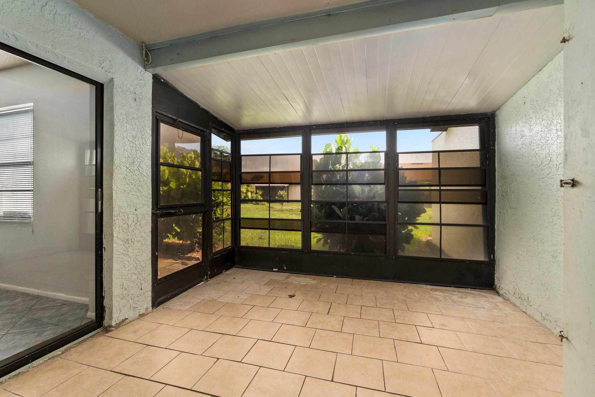 6012 Indrio Road, Unit E2 Fort Pierce, FL 34951 - Photo 20 of 25 a view of an empty room with window