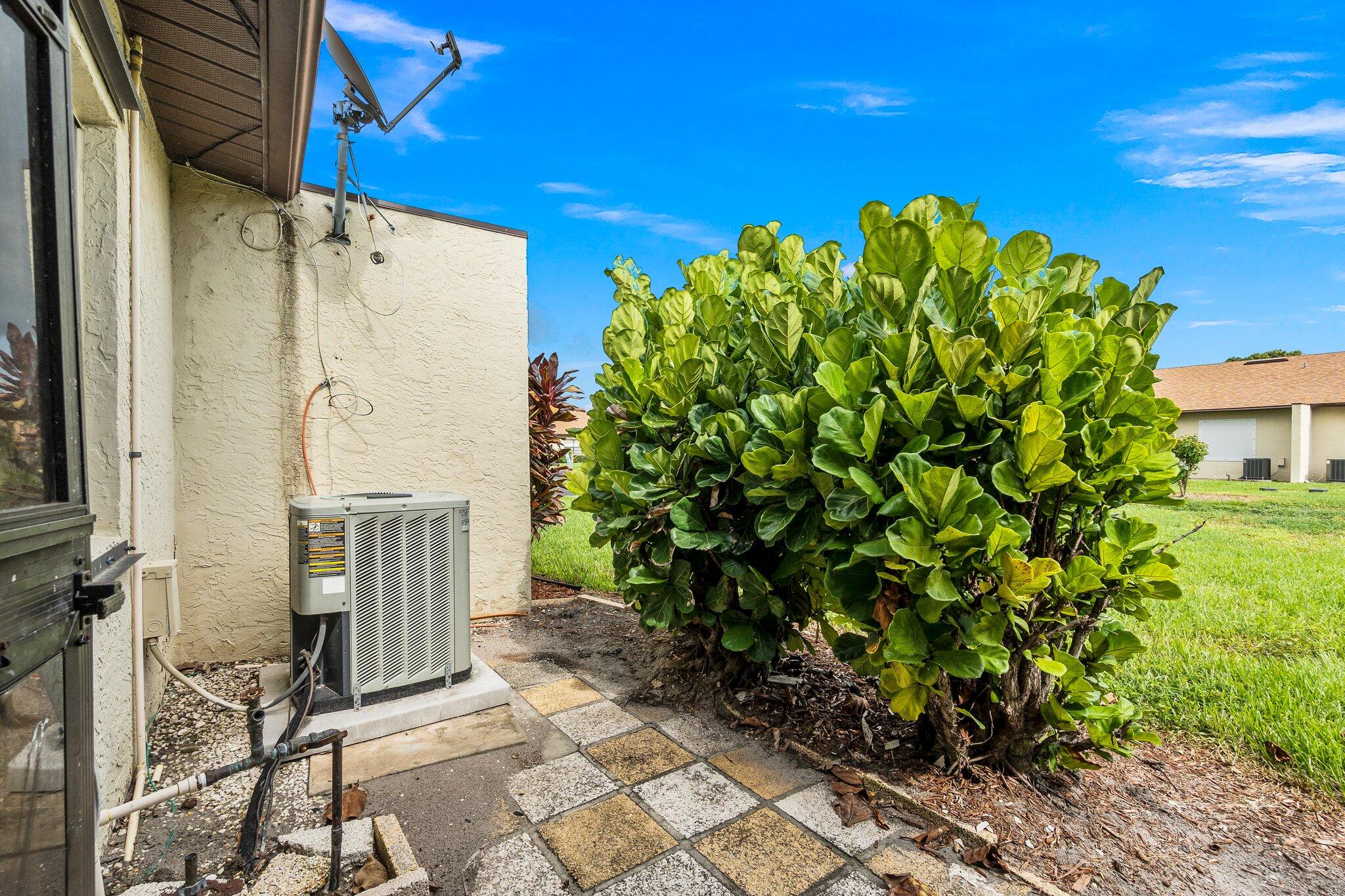 6012 Indrio Road, Unit E2 Fort Pierce, FL 34951 - Photo 25 of 25 a picture of a house with a flower garden