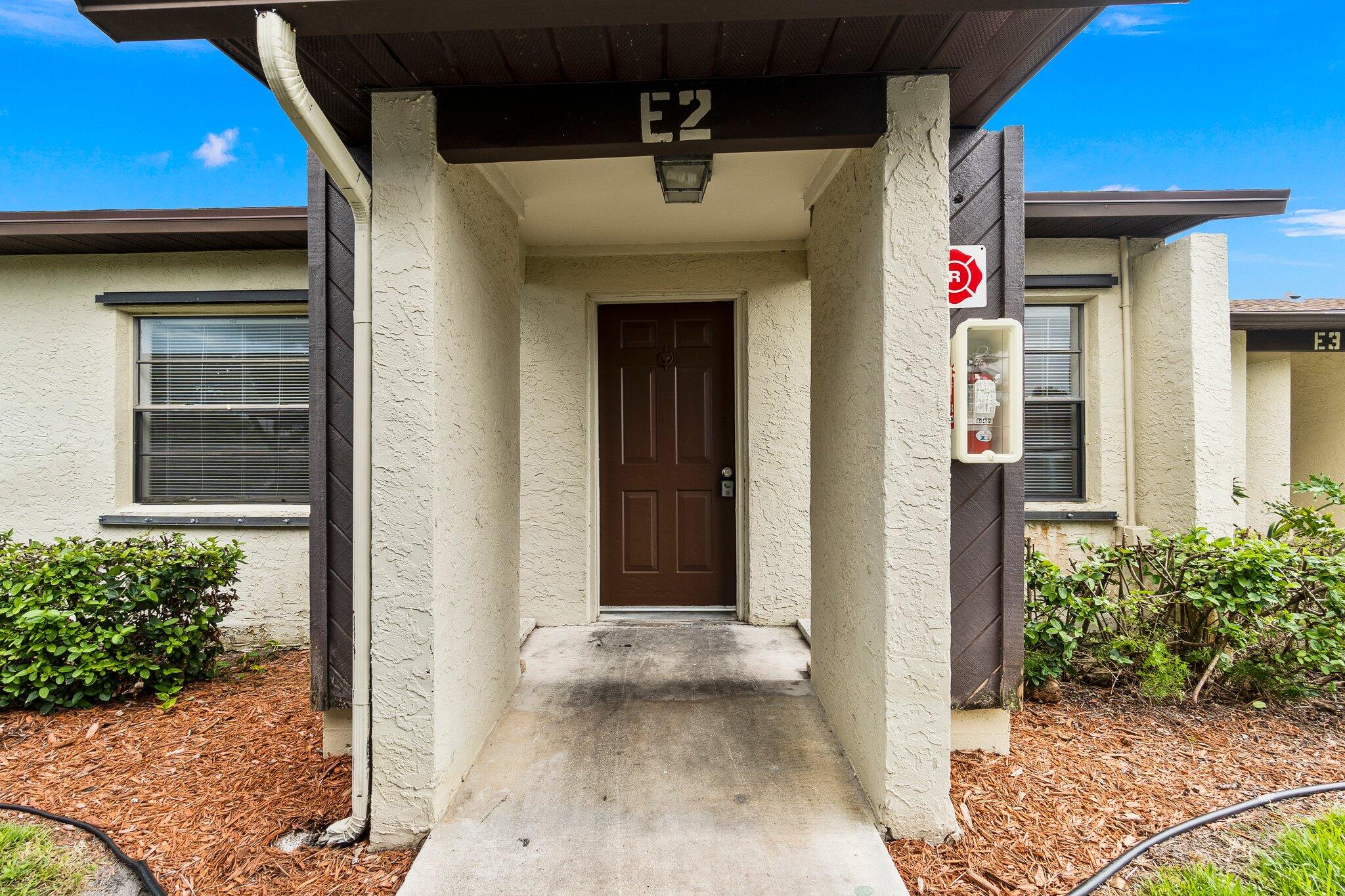 6012 Indrio Road, Unit E2 Fort Pierce, FL 34951 - Photo 4 of 25 a view of an entrance of the house