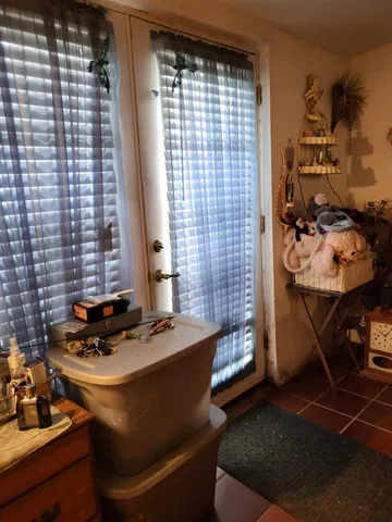 a living room with furniture a rug and a table