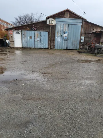 a big room with wooden cabinet and a fireplace