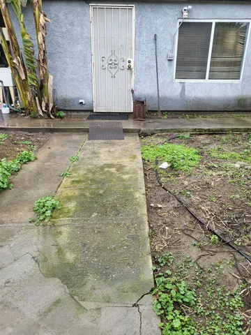 a view of a backyard of the house