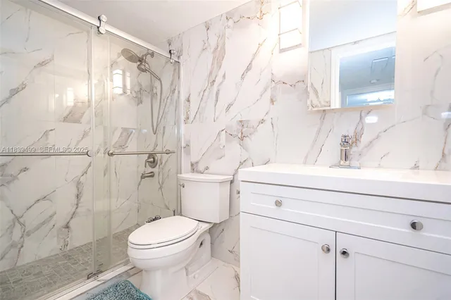 a bathroom with a toilet and a sink