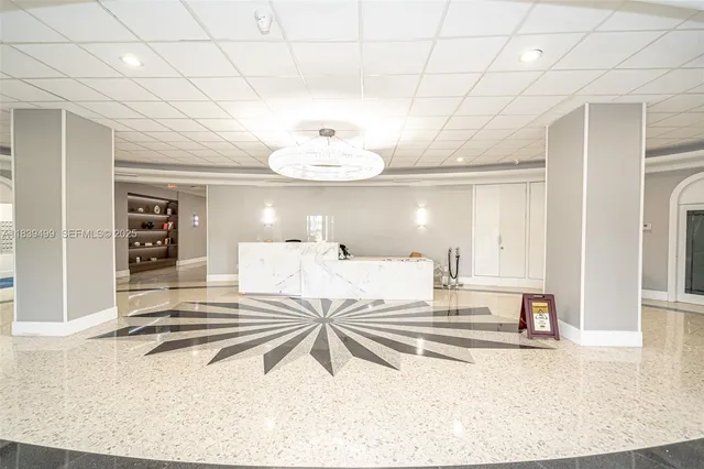 a bedroom with a bed and a view of living room