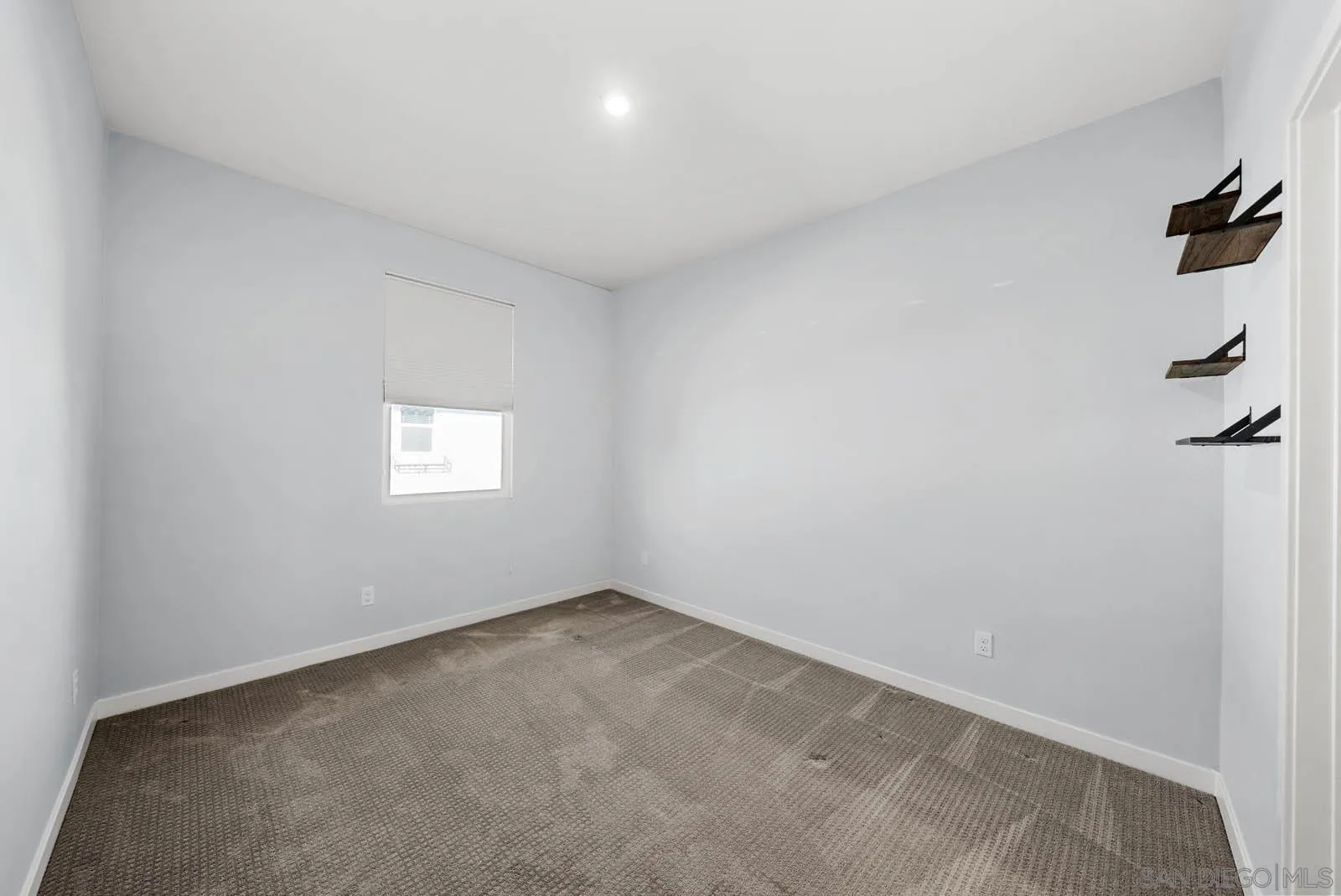 4132 Rio Azul Way Oceanside, CA 92057 - Photo 14 of 48 a view of an empty room and a window