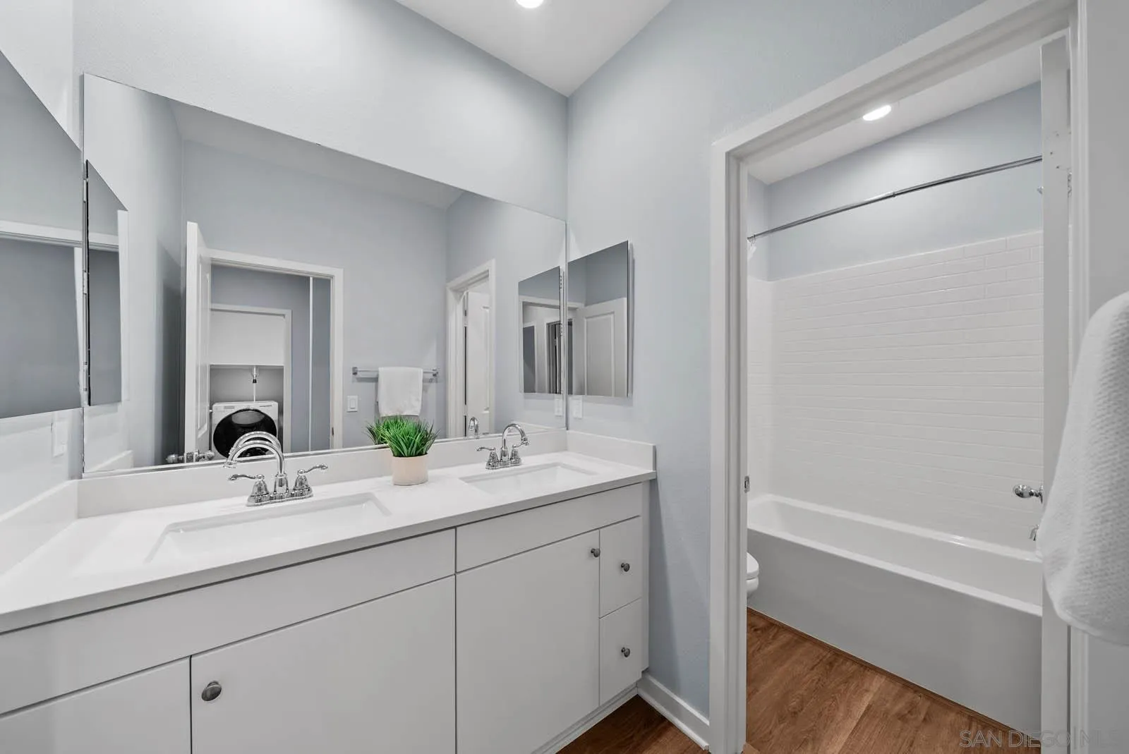 4132 Rio Azul Way Oceanside, CA 92057 - Photo 16 of 48 a bathroom with a double vanity sink mirror and shower