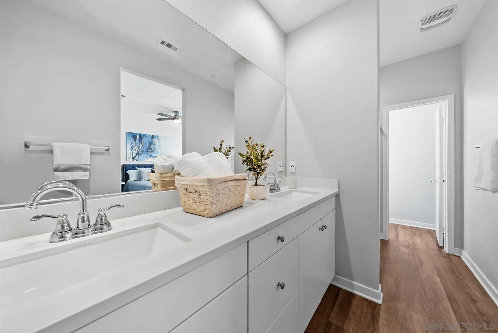4132 Rio Azul Way Oceanside, CA 92057 - Photo 20 of 48 a bathroom with a double vanity sink and a mirror