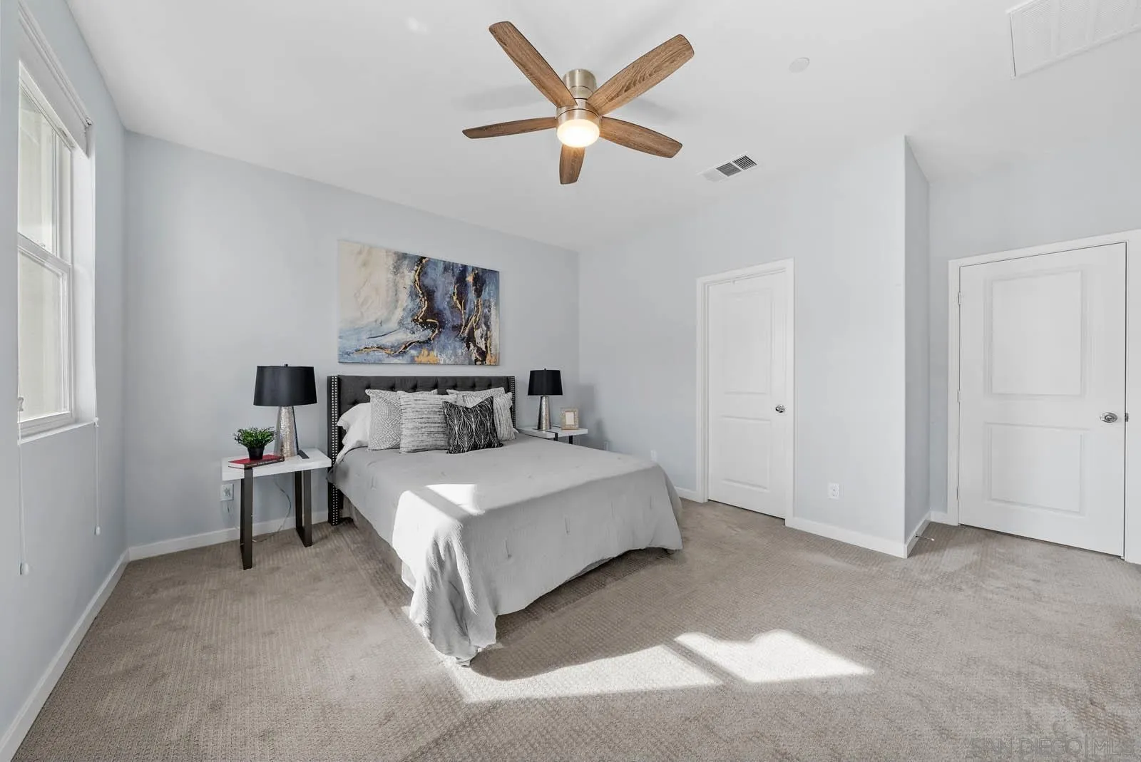 4132 Rio Azul Way Oceanside, CA 92057 - Photo 23 of 48 a bed room with a bed and window