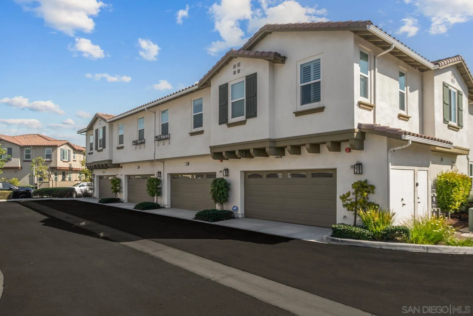 4132 Rio Azul Way Oceanside, CA 92057 - Photo 28 of 48 a front view of a house with a yard and garage