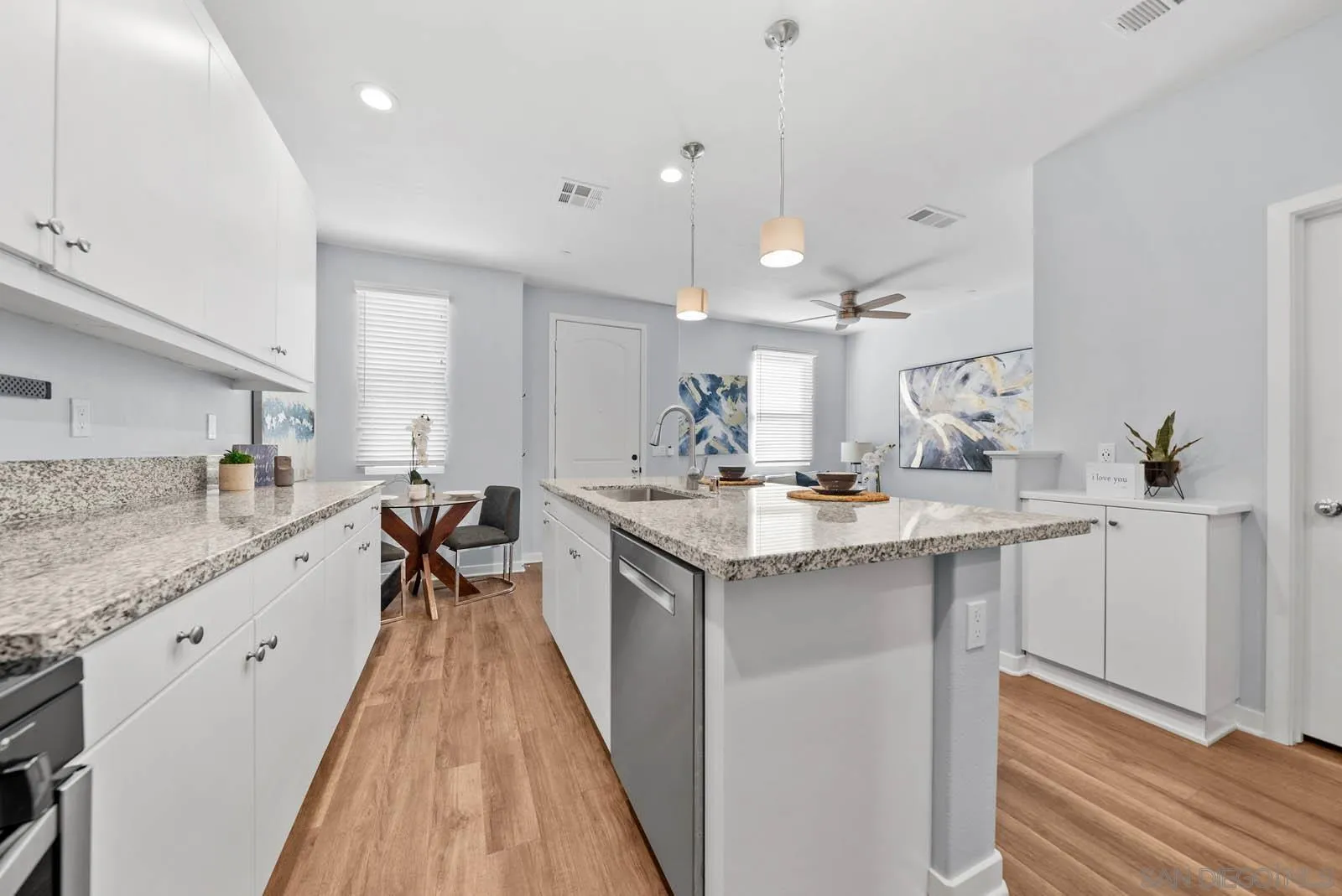 4132 Rio Azul Way Oceanside, CA 92057 - Photo 5 of 48 a kitchen with a sink a counter top space and appliances