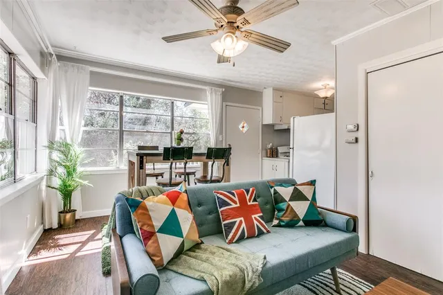 a view of a dining room with a table and chairs