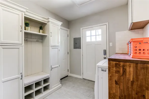 a bathroom with a granite countertop sink a mirror and toilet