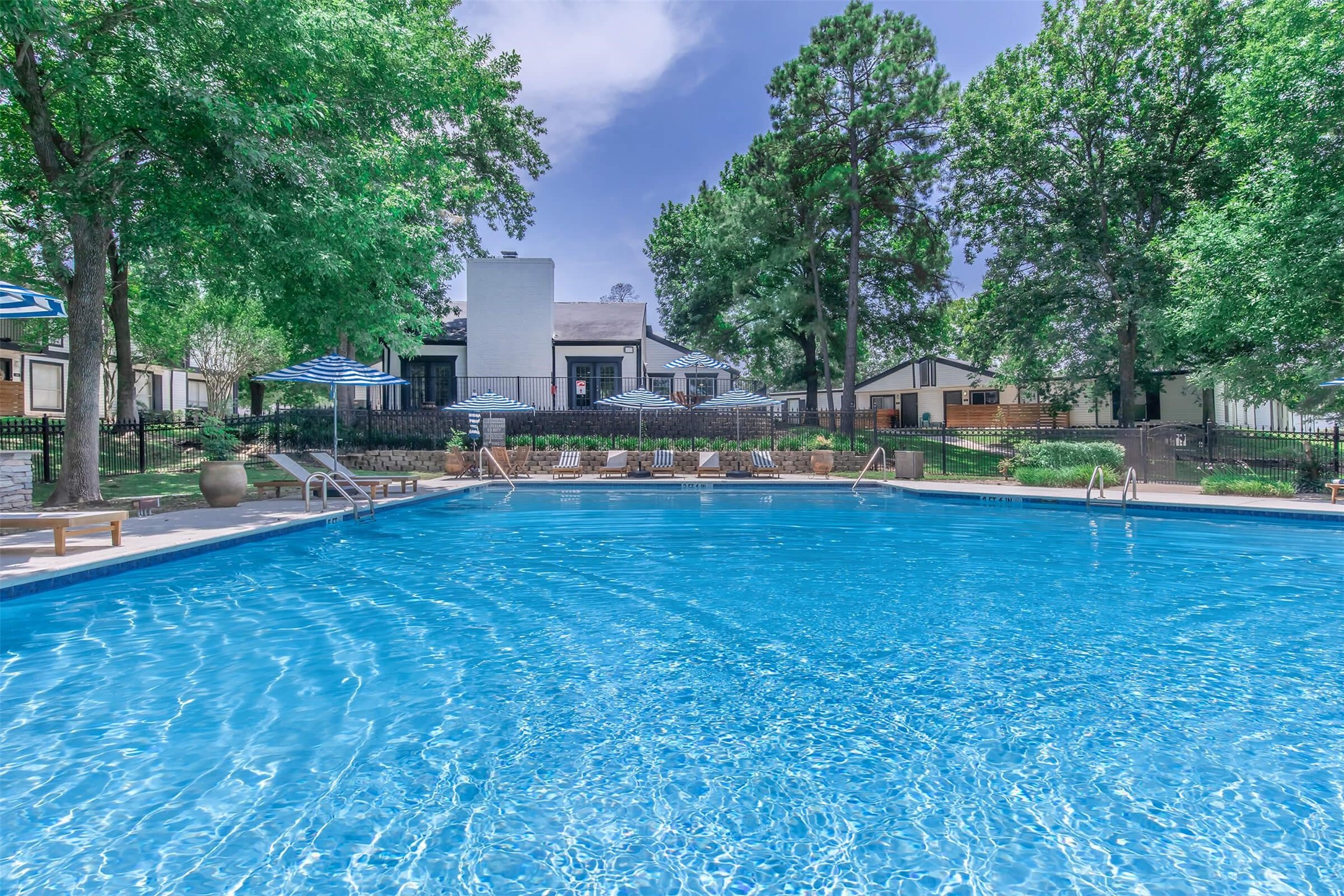 18001 Cypress Trace Road, Unit 1406 Houston, TX 77090 - Photo 32 of 32 a view of a house with swimming pool and sitting area