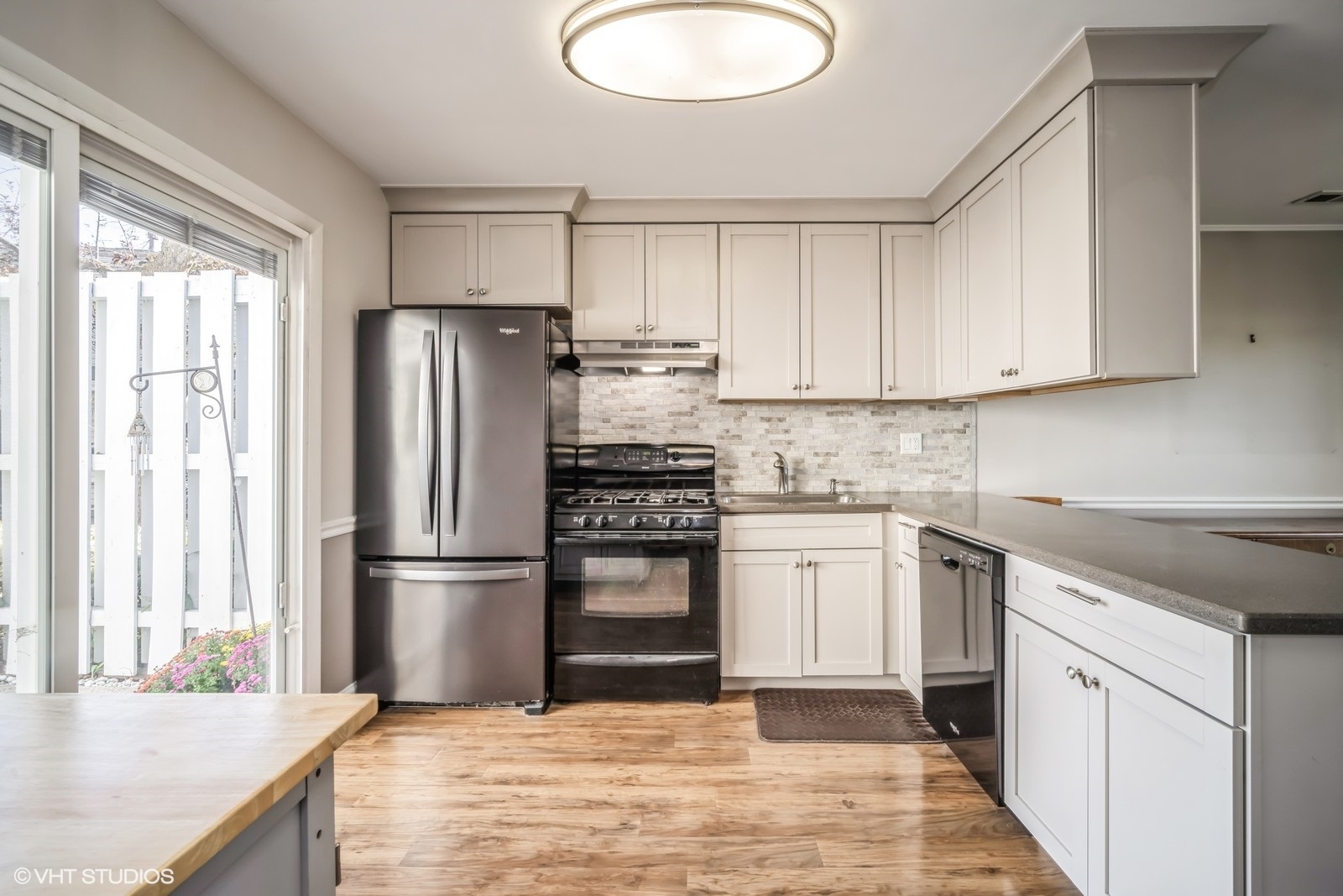 793 Barnaby Place Wheeling, IL 60090 - Photo 2 of 10 a kitchen with granite countertop a refrigerator stove top oven and sink