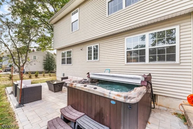 a view of a patio with table and chairs and potted plants