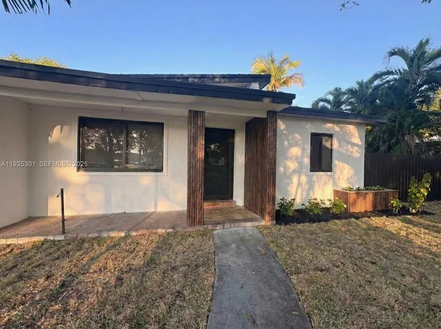 a view of a house with large windows