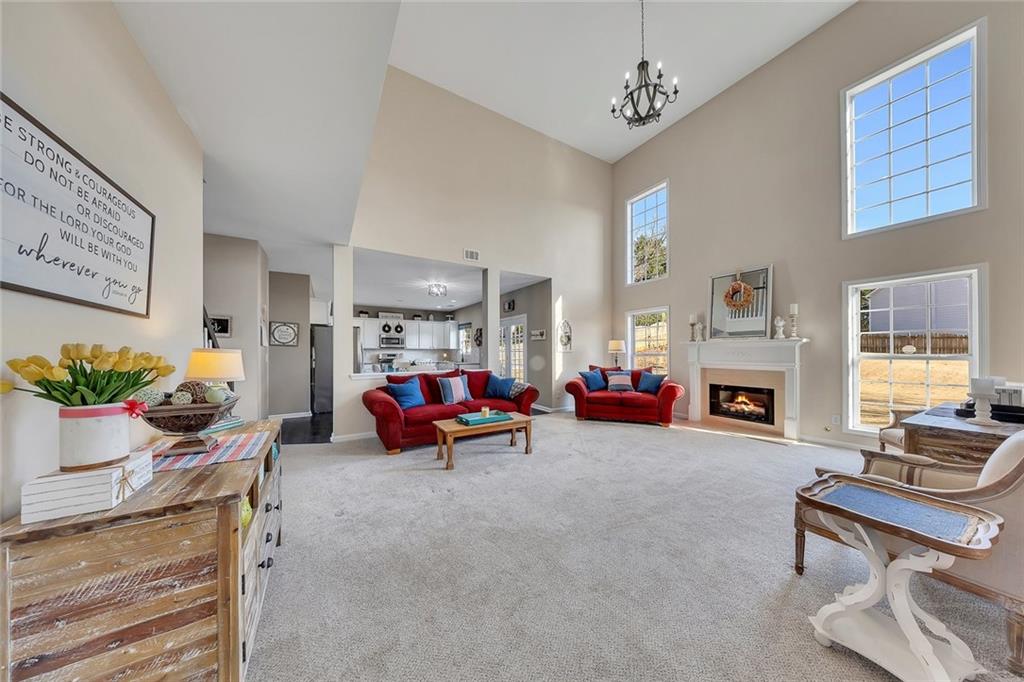 605 Garnet Court Canton, GA 30114 - Photo 13 of 75 a view of a livingroom with furniture and a fireplace
