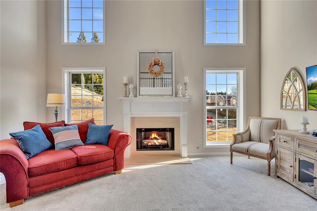 605 Garnet Court Canton, GA 30114 - Photo 15 of 75 a living room with furniture and a fireplace
