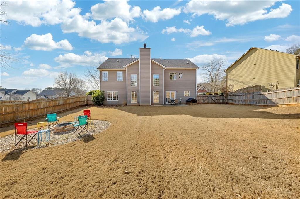 605 Garnet Court Canton, GA 30114 - Photo 48 of 75 a front view of house with yard and seating