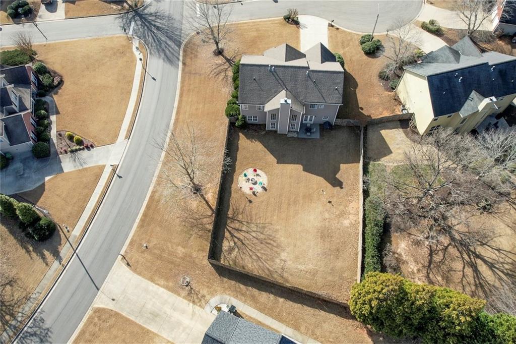 605 Garnet Court Canton, GA 30114 - Photo 54 of 75 an aerial view of a house with a yard