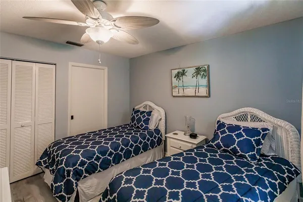 a bedroom with bed and a window