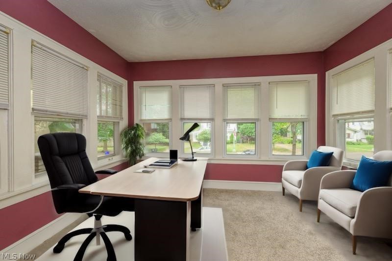 1222 Ridge Road Northwest Canton, OH 44703 - Photo 9 of 32 Sun room with multiple windows to let all of the natural light in with ai inserted furniture being used as an office