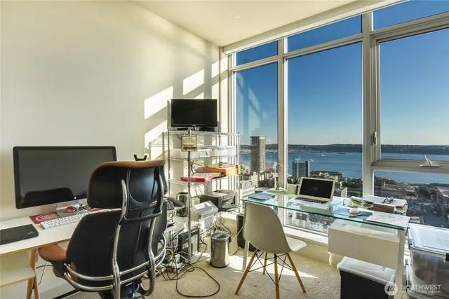 a work place with furniture and flat screen tv