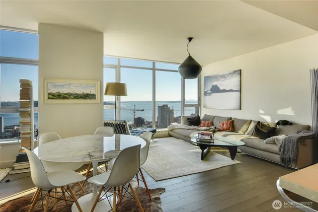 a living room with fireplace furniture and a wooden floor